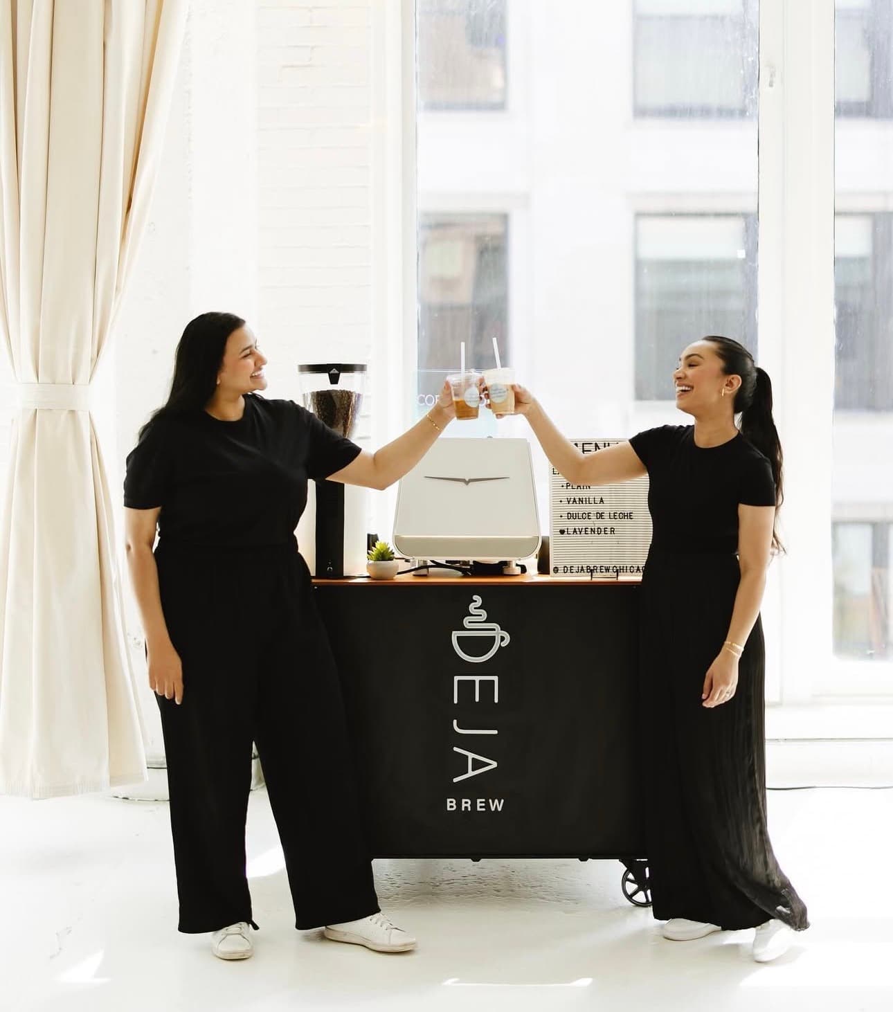 Sara and Anum toasting at the cart
